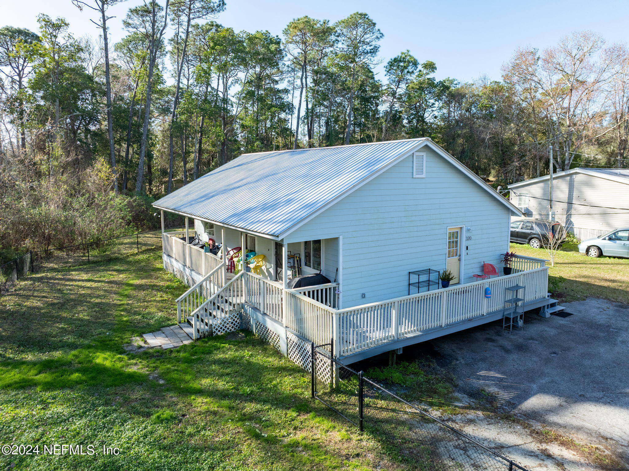 320 Katnack Road St. Augustine, FL 32095 - Photo 26 of 33 a view of a house with a yard and deck