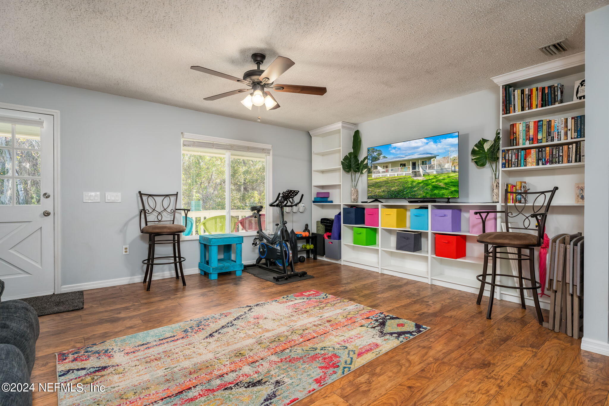 320 Katnack Road St. Augustine, FL 32095 - Photo 5 of 33 a living room with lots of furniture and a flat screen tv