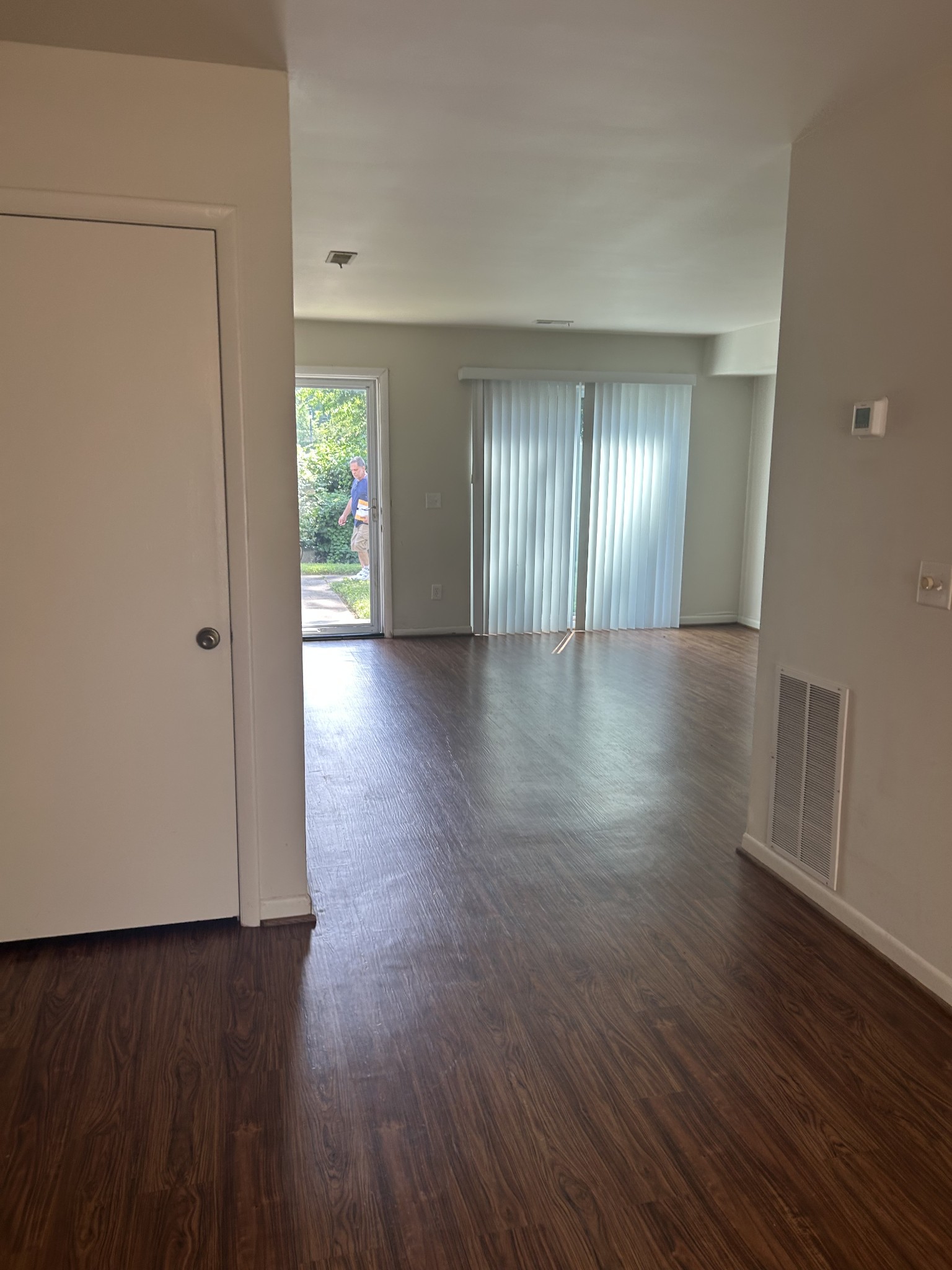 604 Granville Road, Unit 604 Franklin, TN 37064 - Photo 17 of 24 a view of an empty room with wooden floor and a window