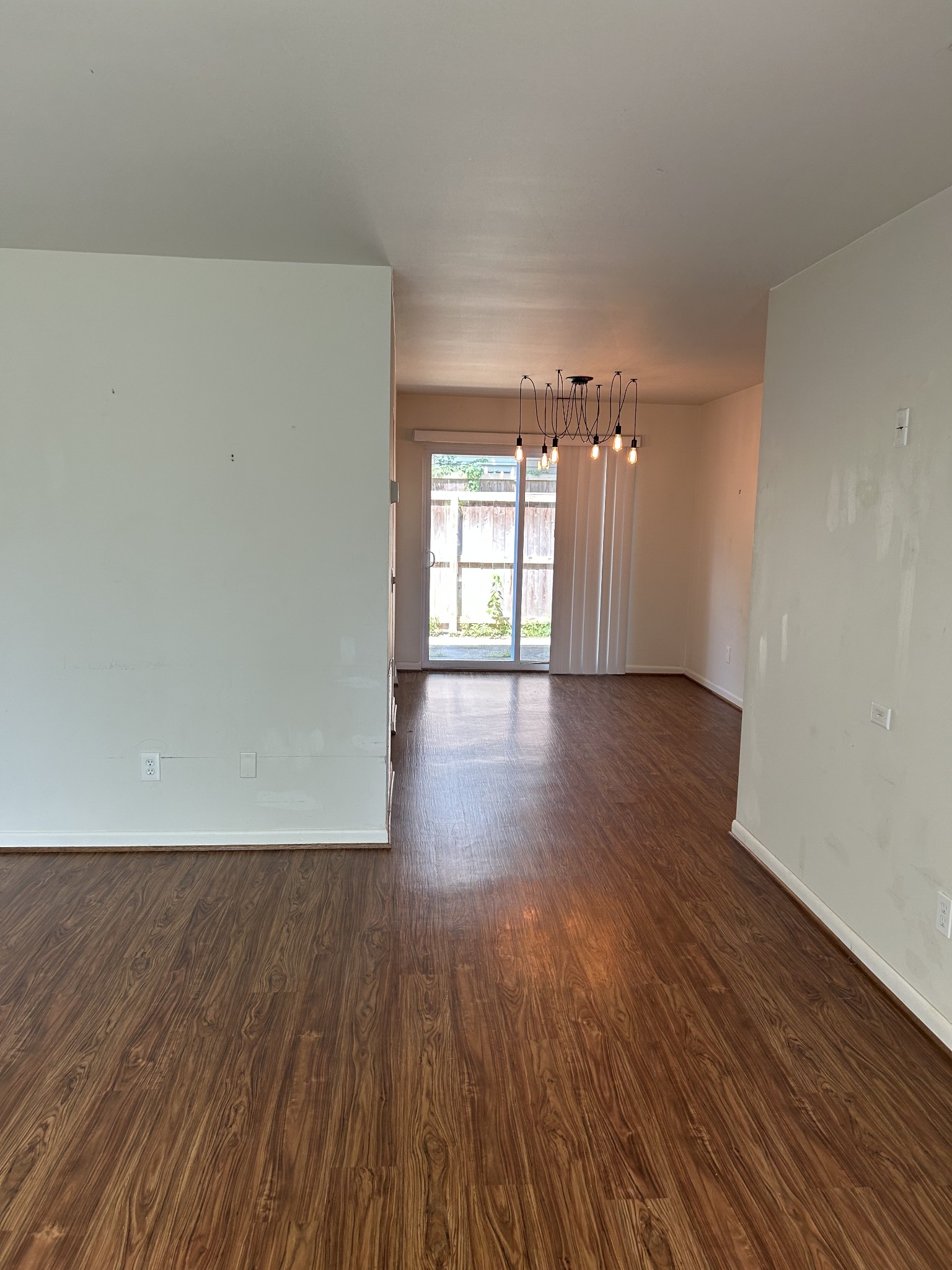 604 Granville Road, Unit 604 Franklin, TN 37064 - Photo 9 of 24 wooden floor in an empty room with a window