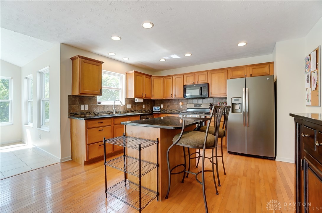 6042 Kay Court Riverside, OH 45424 - Photo 8 of 29 Kitchen. Notice the granite counters and hardwood floors.