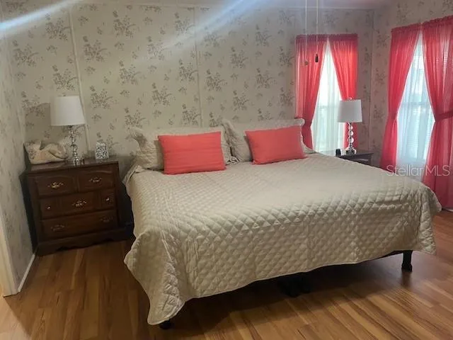 a bedroom with a bed and a dresser