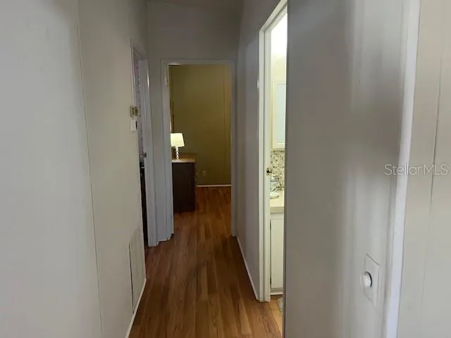 a view of a bathroom from a hallway