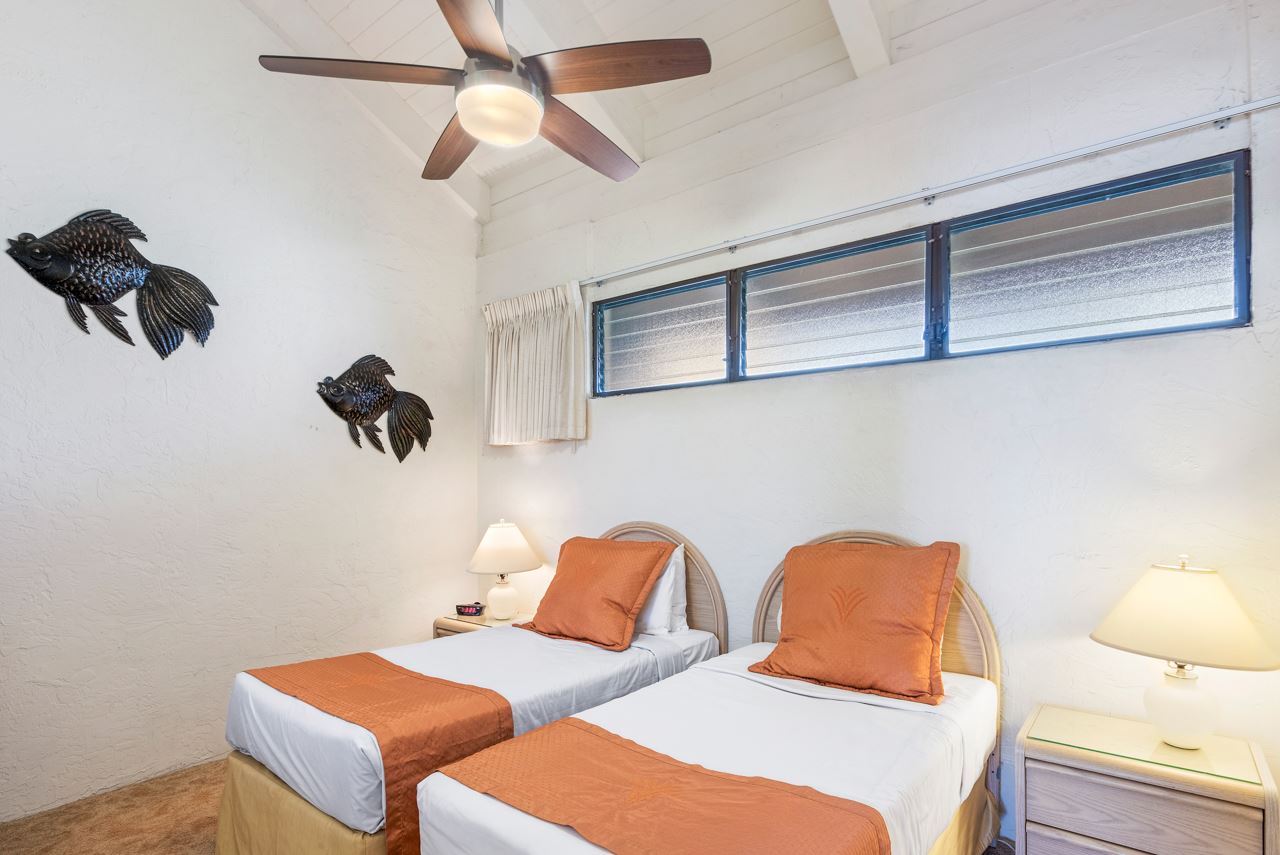 3543 Lower Honoapiilani Road, Unit F405 Lahaina, HI 96761 - Photo 17 of 30 a bedroom with two beds and painted walls