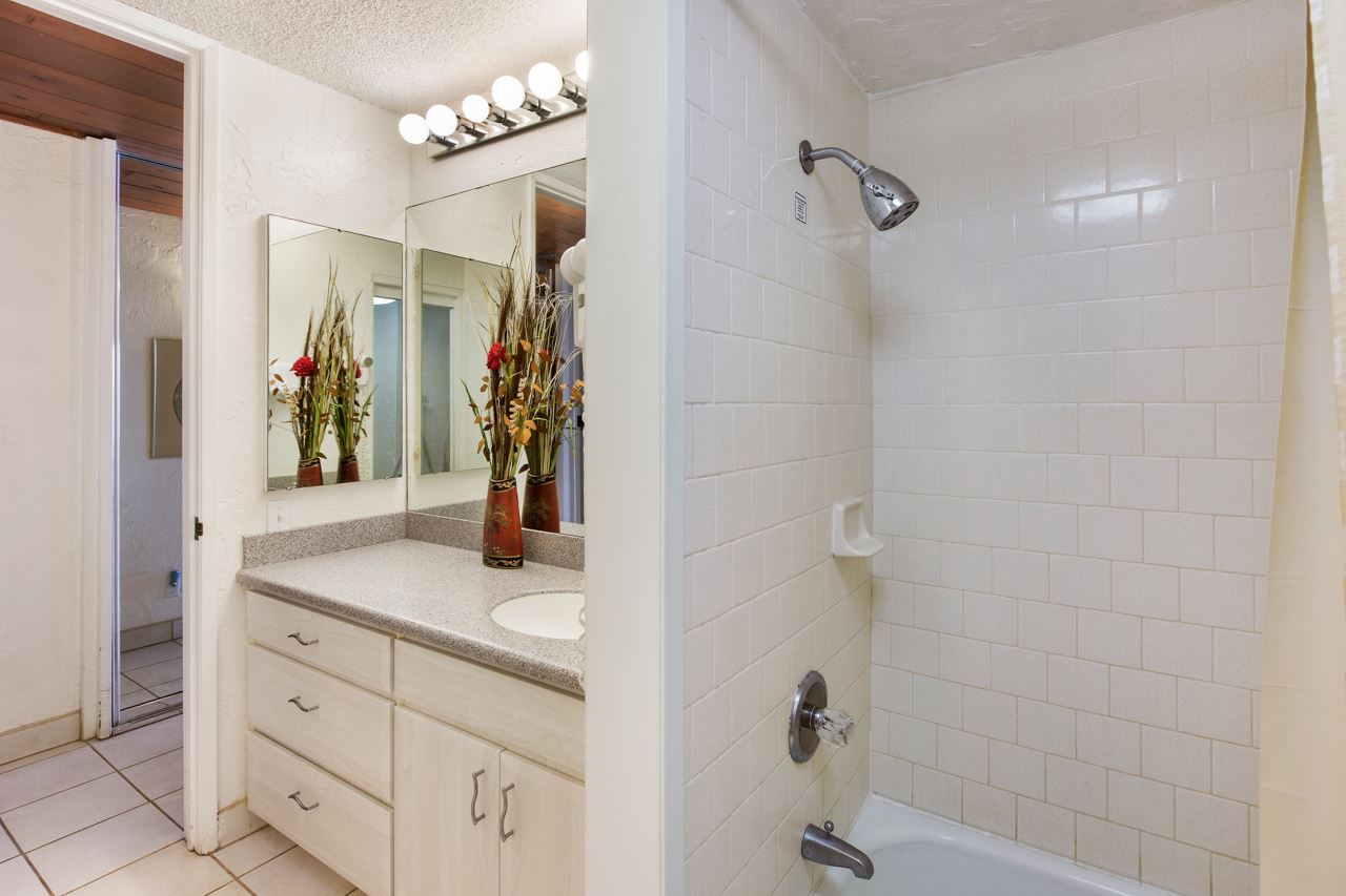 3543 Lower Honoapiilani Road, Unit F405 Lahaina, HI 96761 - Photo 21 of 30 a bathroom with a sink two mirror and shower