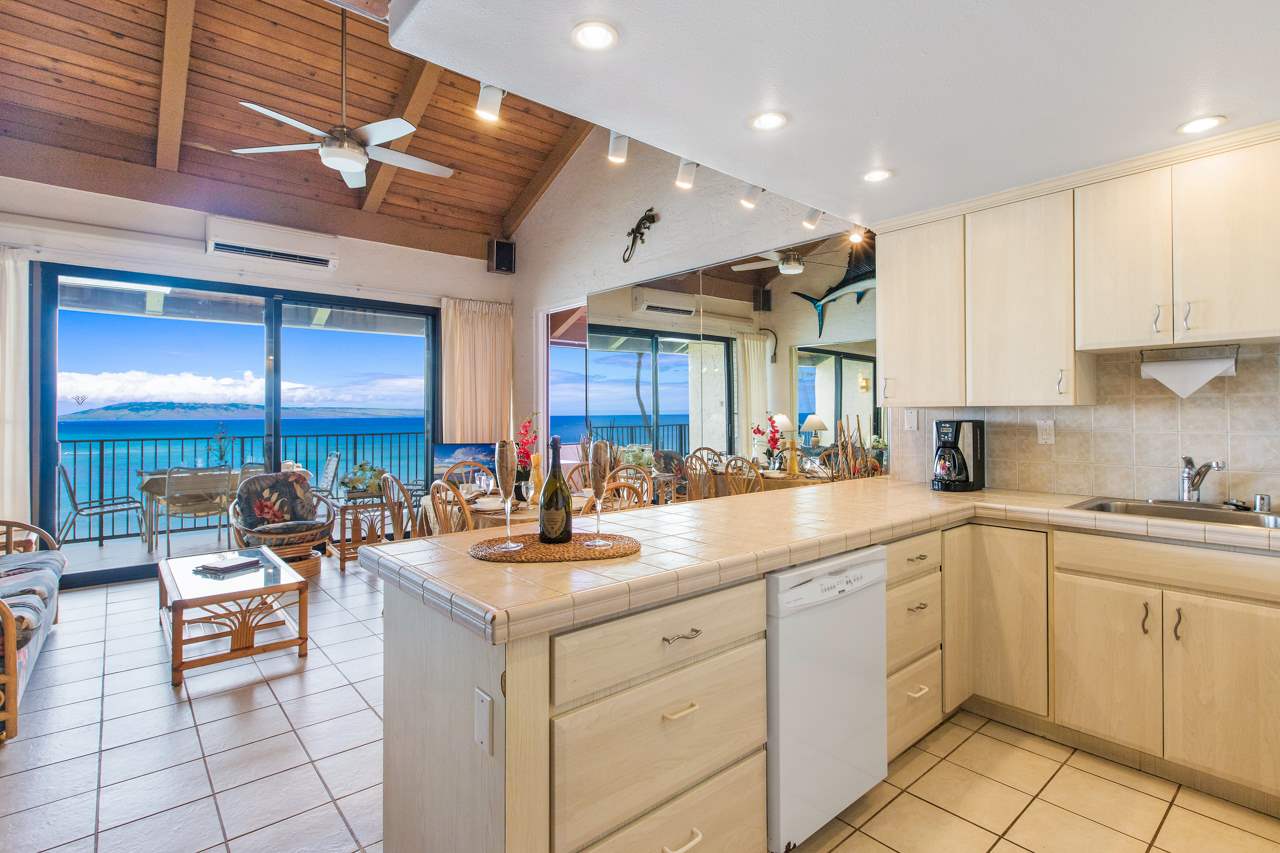 3543 Lower Honoapiilani Road, Unit F405 Lahaina, HI 96761 - Photo 22 of 30 a kitchen with cabinets a sink and appliances