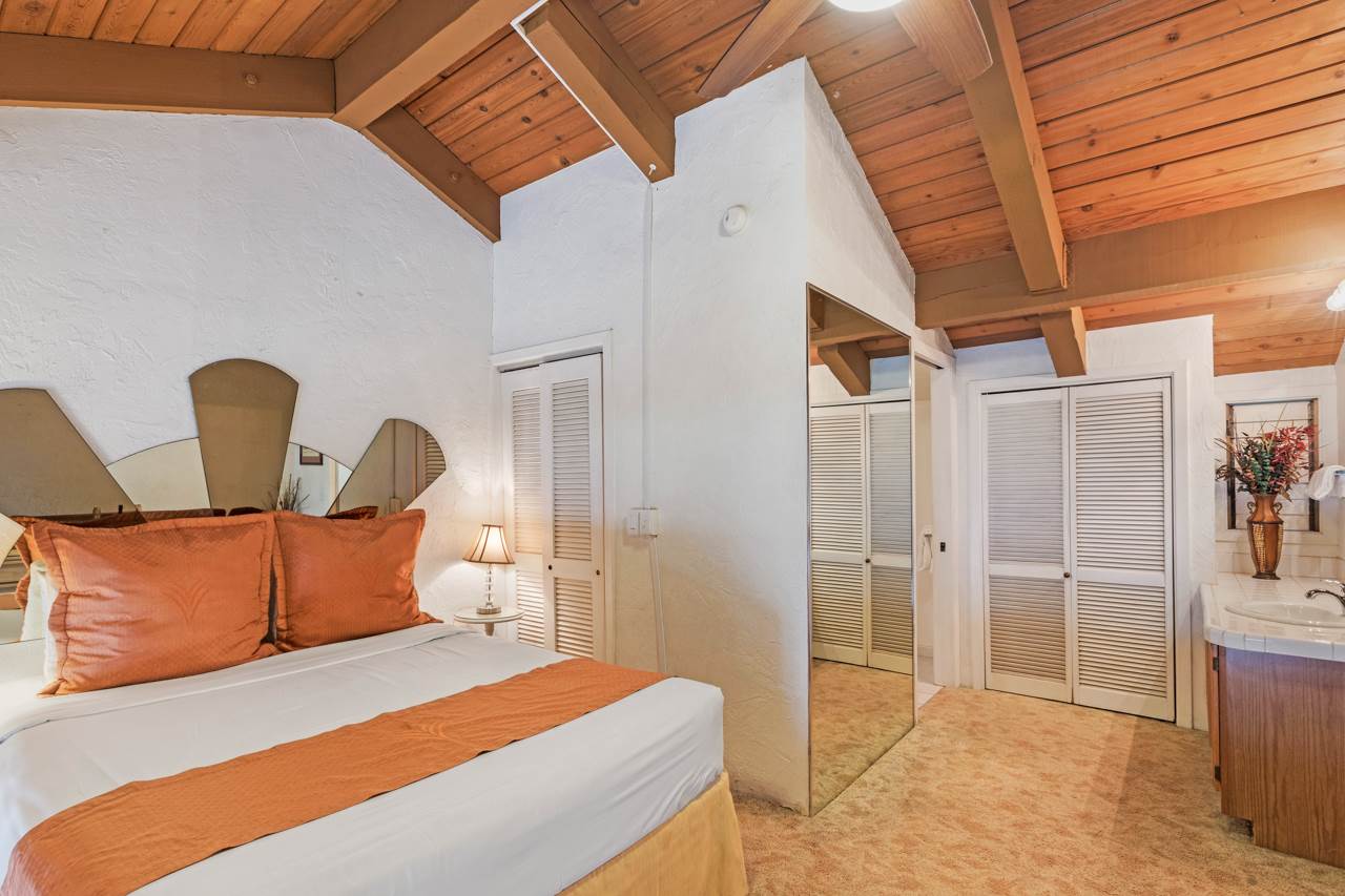 3543 Lower Honoapiilani Road, Unit F405 Lahaina, HI 96761 - Photo 29 of 30 a bedroom with bed and walk in closet