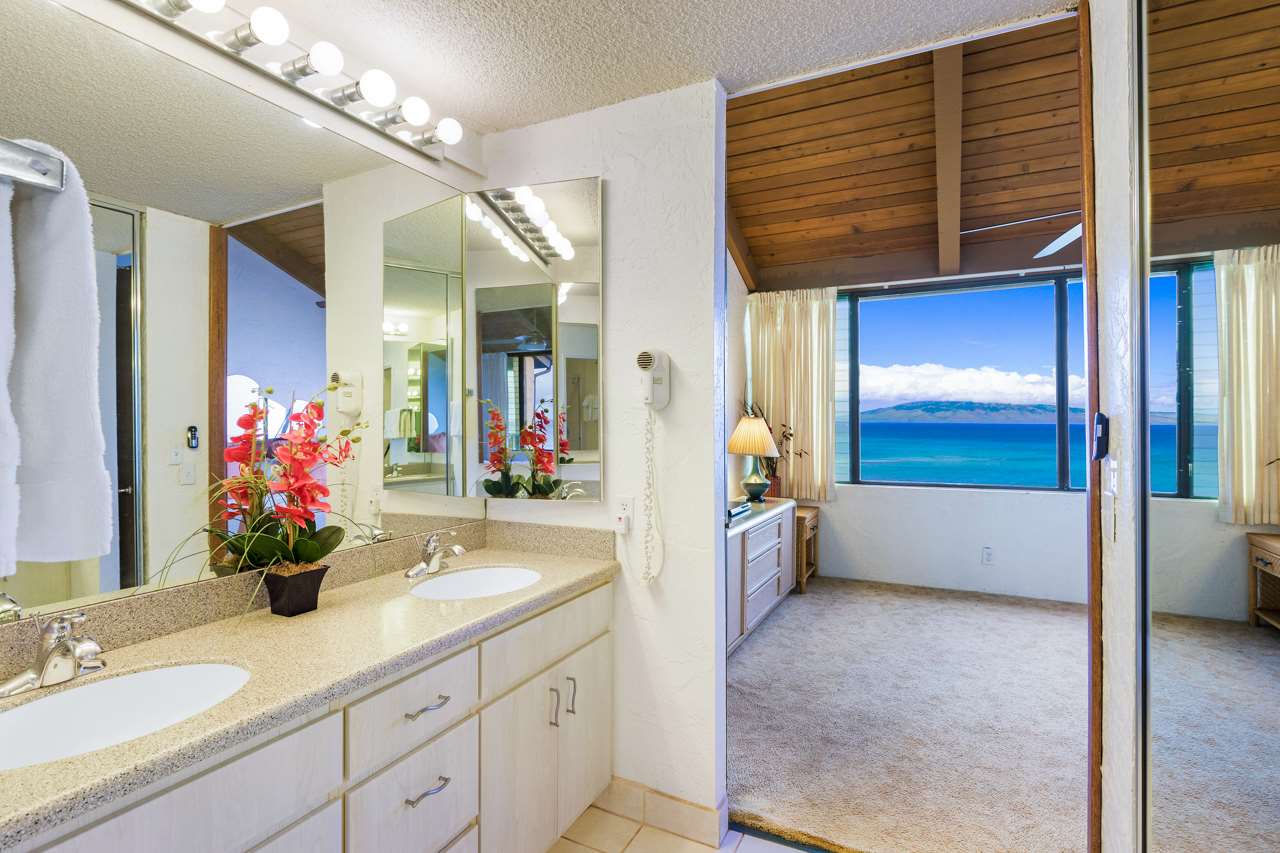 3543 Lower Honoapiilani Road, Unit F405 Lahaina, HI 96761 - Photo 8 of 30 a bathroom with a tub sink and mirror