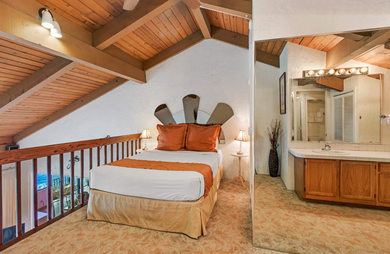 3543 Lower Honoapiilani Road, Unit F405 Lahaina, HI 96761 - Photo 9 of 30 a bed room with a bed and a table