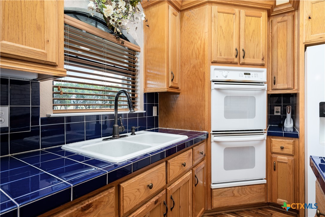 11705 Fm 439 Belton, TX 76513 - Photo 15 of 42 a kitchen that has a stove and a refrigerator