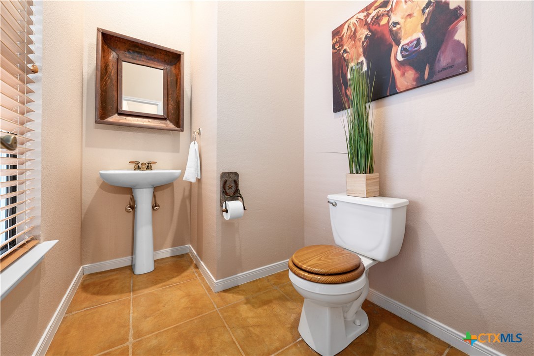 11705 Fm 439 Belton, TX 76513 - Photo 26 of 42 a bathroom with a toilet and a sink