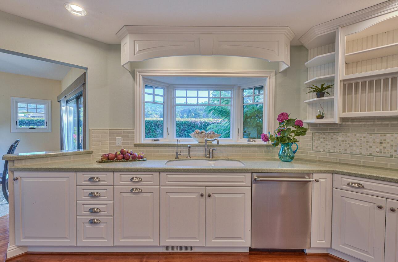 8022 River Place Carmel, CA 93923 - Photo 18 of 39 a kitchen with cabinets and window
