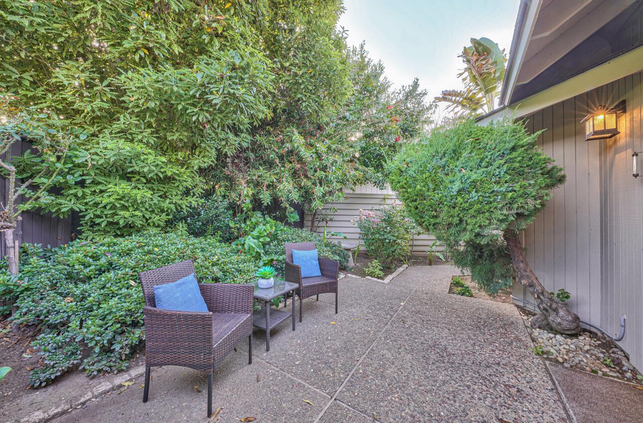 8022 River Place Carmel, CA 93923 - Photo 24 of 39 a view of a chairs and table in the backyard