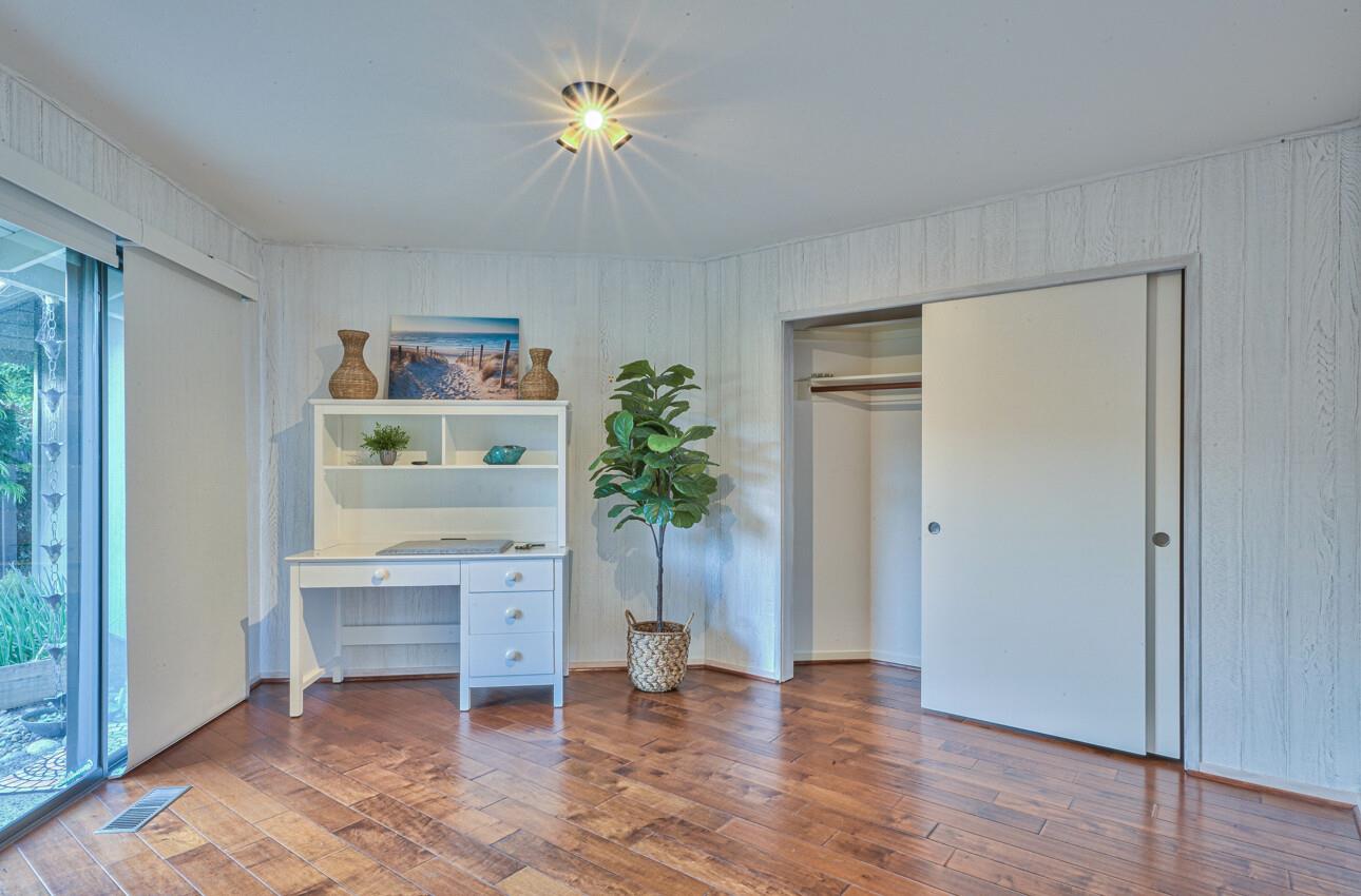 8022 River Place Carmel, CA 93923 - Photo 29 of 39 a view of an empty room with a window and wooden floor