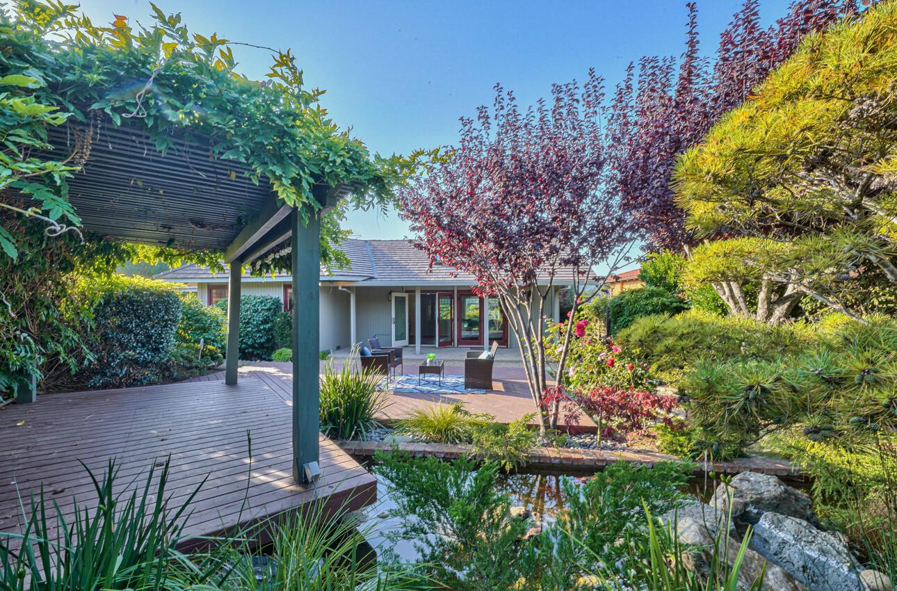 8022 River Place Carmel, CA 93923 - Photo 36 of 39 a view of a house with backyard and sitting area