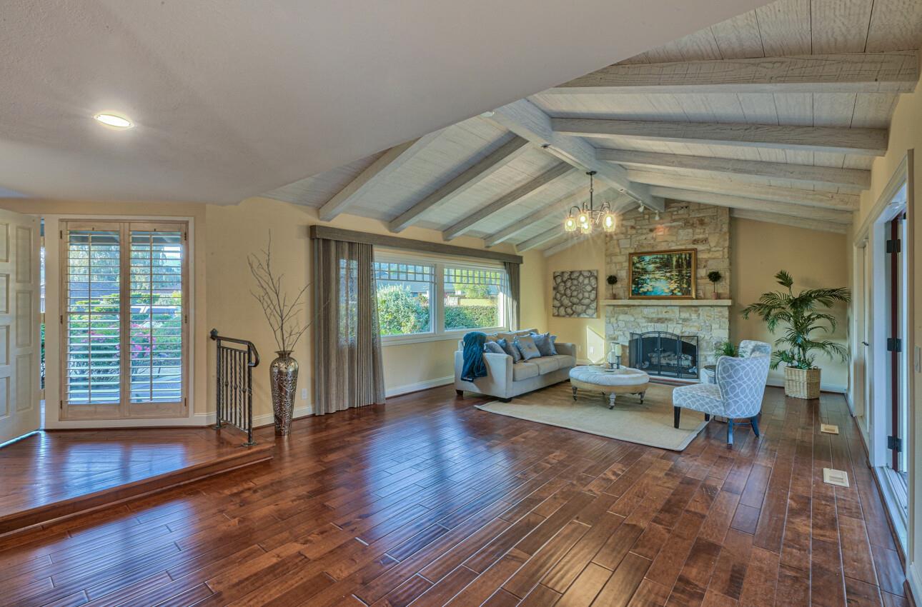 8022 River Place Carmel, CA 93923 - Photo 7 of 39 a living room with furniture and a wooden floor