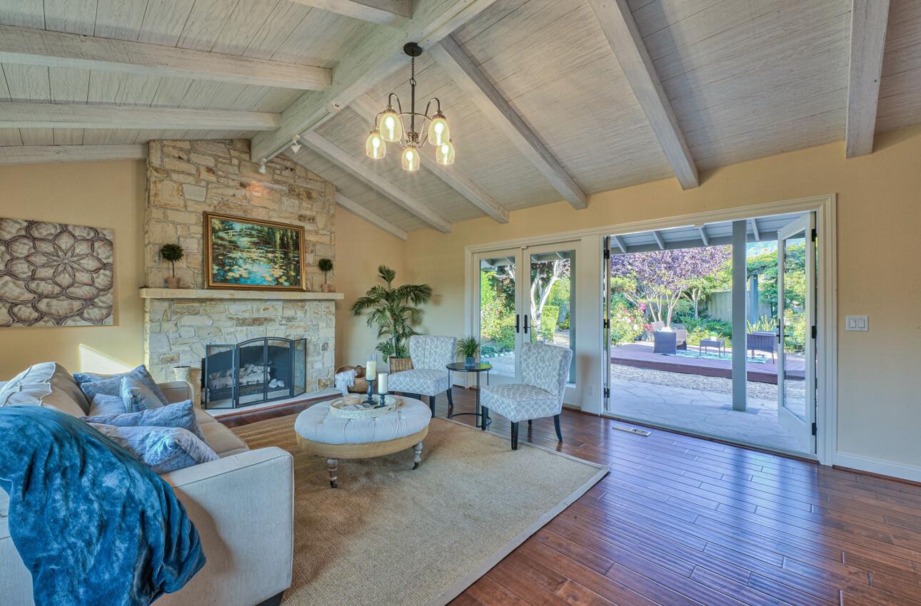 8022 River Place Carmel, CA 93923 - Photo 8 of 39 a living room with furniture and a fireplace