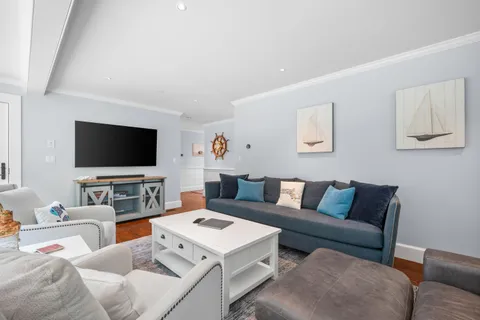 a bedroom with a balcony a bed and a couch