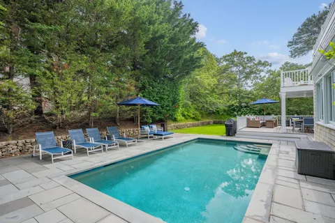 an aerial view of a houses with a yard
