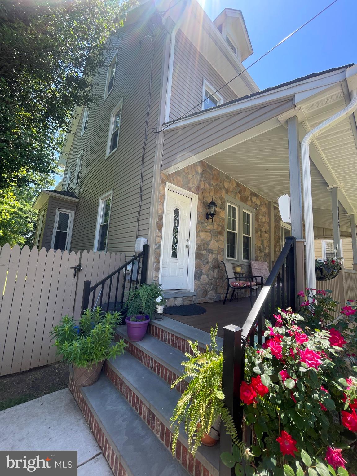 8129 Pine Road Philadelphia, PA 19111 - Photo 2 of 40 Charming entrance with vibrant blooms.