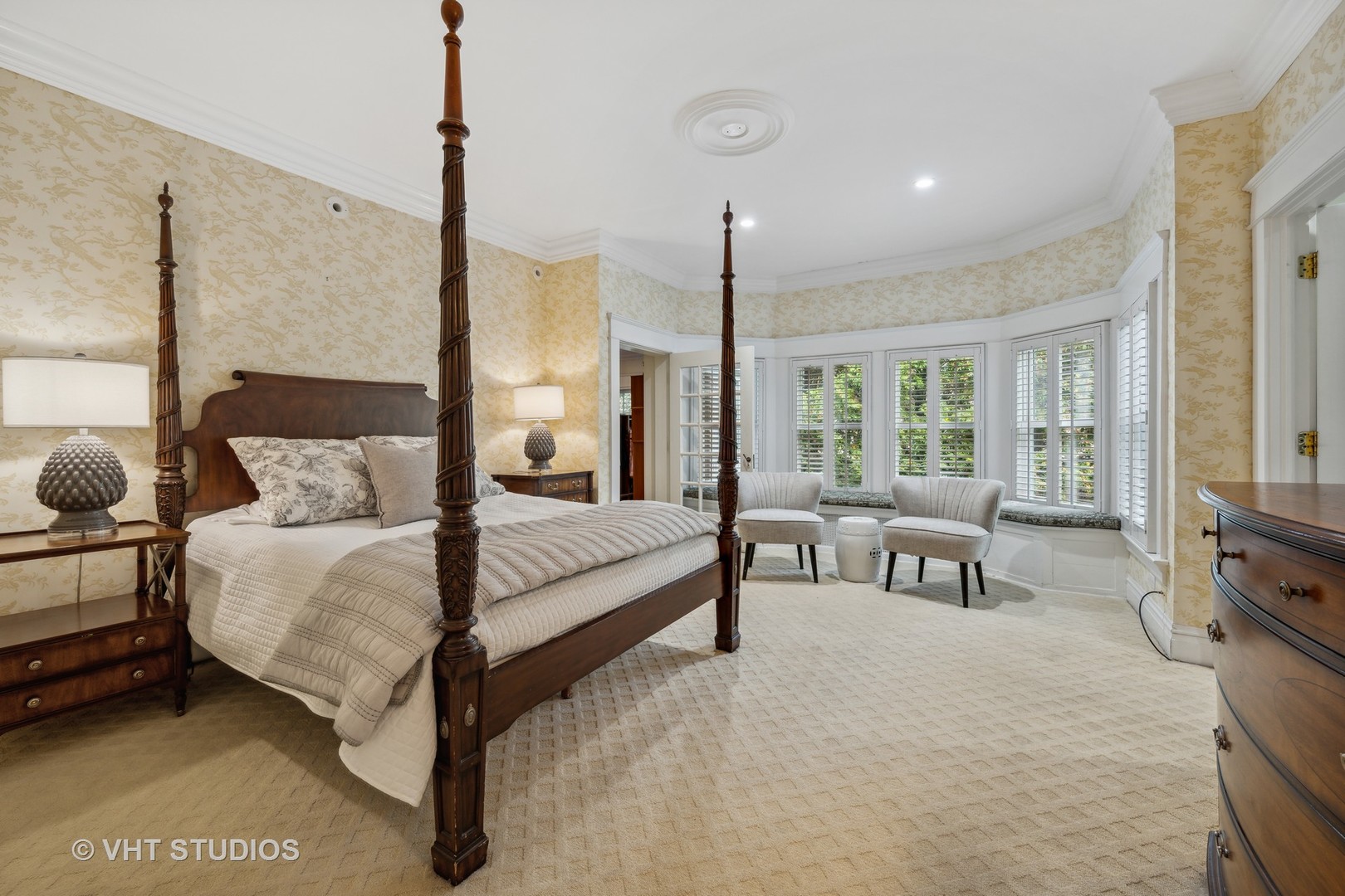 527 Cherry Street Winnetka, IL 60093 - Photo 19 of 43 a spacious bedroom with a bed a couch and large window