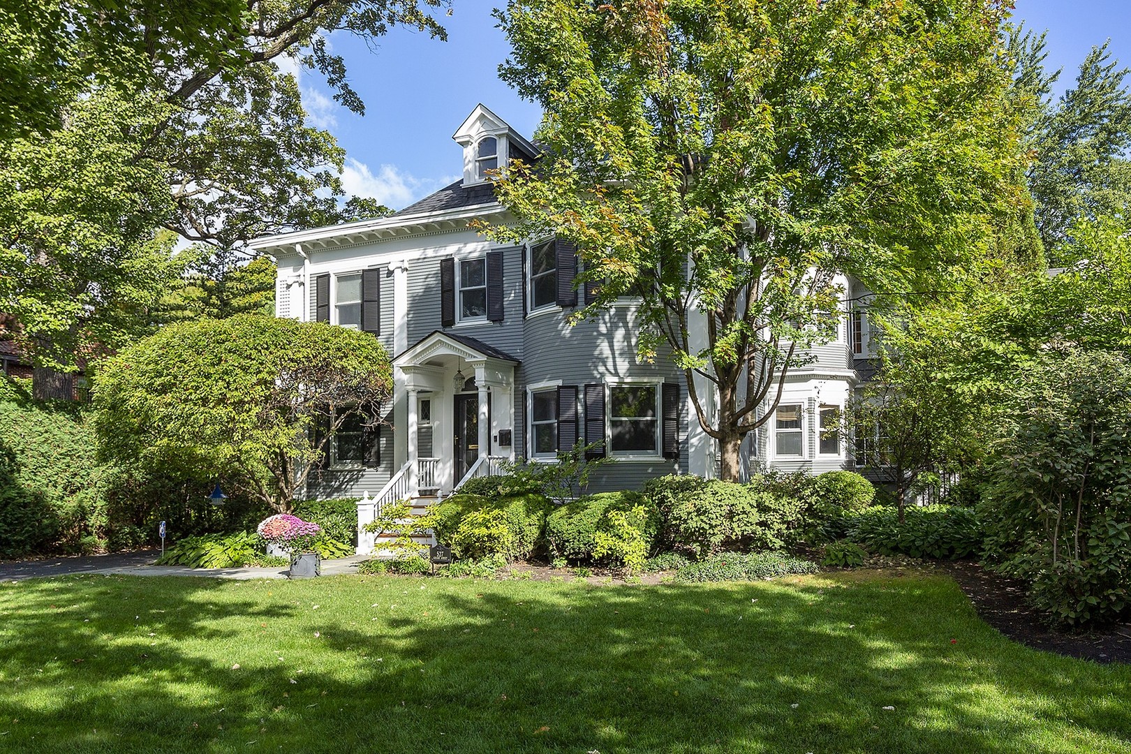 527 Cherry Street Winnetka, IL 60093 - Photo 2 of 43 a front view of a house with a yard