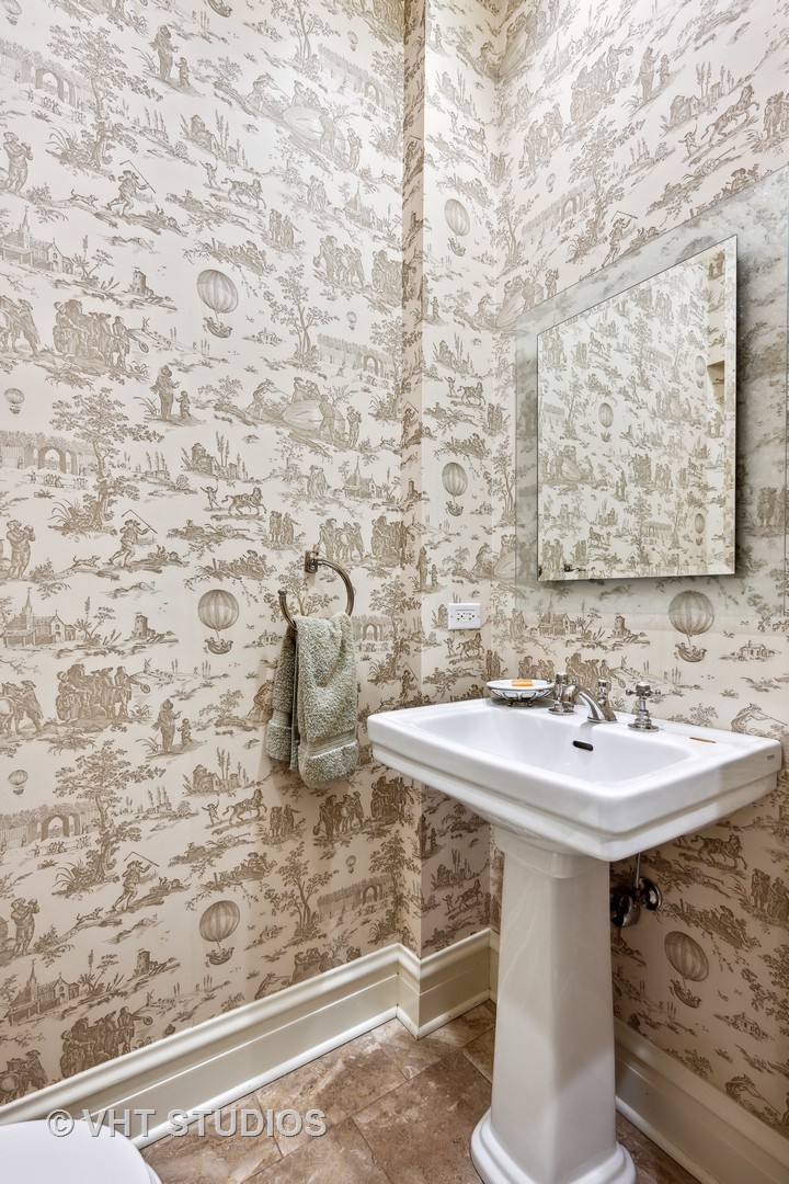 527 Cherry Street Winnetka, IL 60093 - Photo 32 of 43 a bathroom with a sink and a mirror