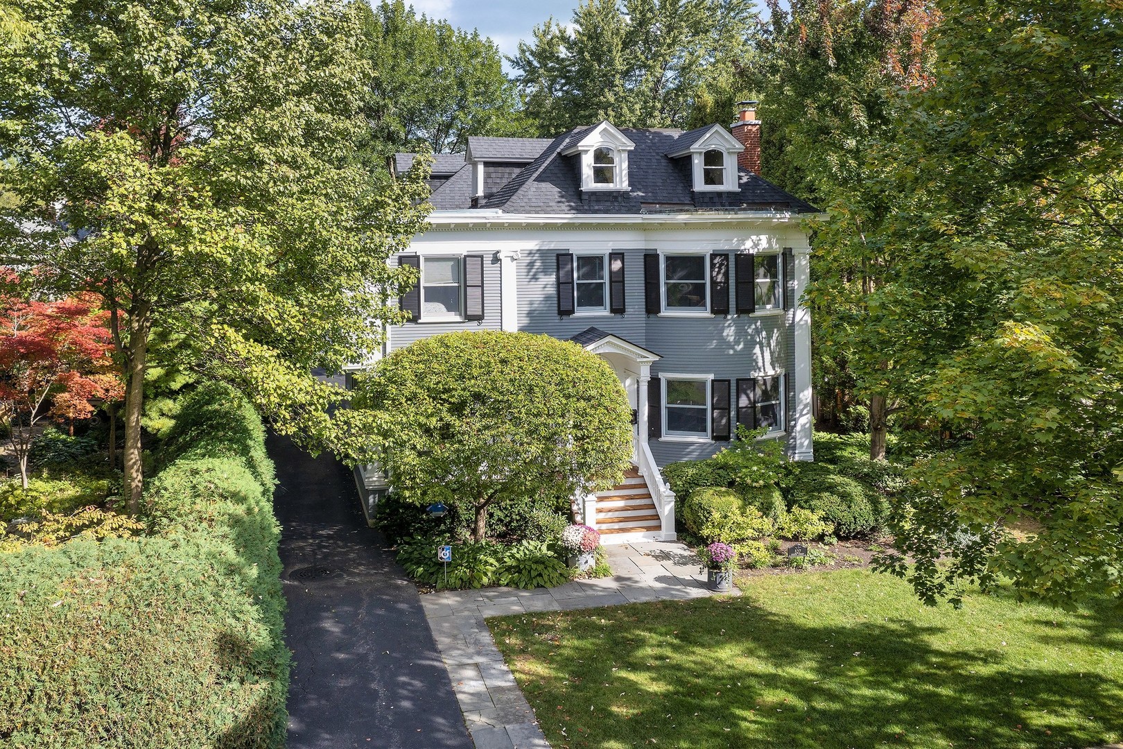 527 Cherry Street Winnetka, IL 60093 - Photo 38 of 43 a front view of a house with a garden
