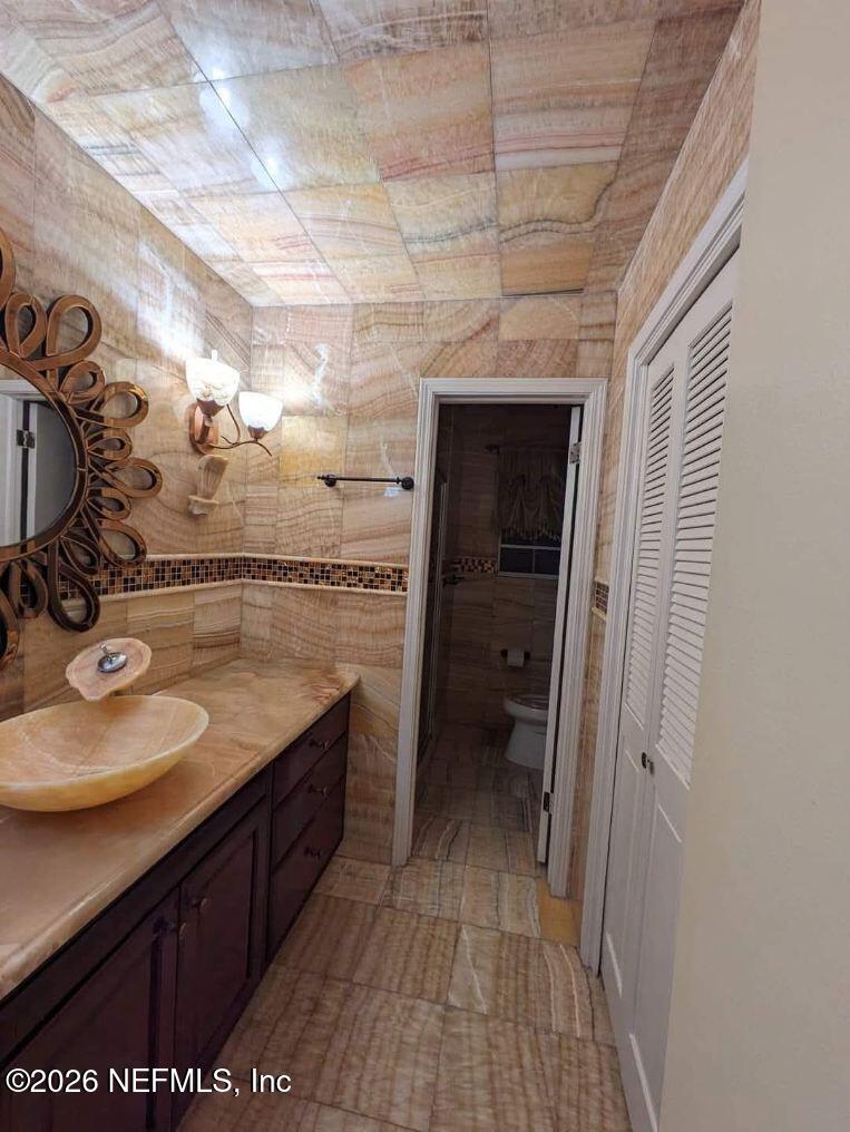 4442 River Trail Road Jacksonville, FL 32277 - Photo 12 of 38 a bathroom with a sink and a mirror