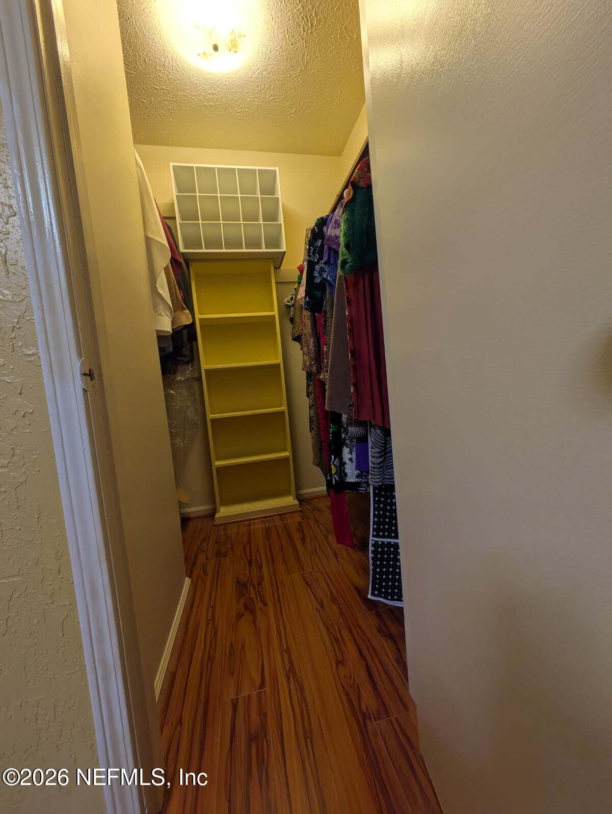 4442 River Trail Road Jacksonville, FL 32277 - Photo 36 of 38 a view of walk in closet with clothes