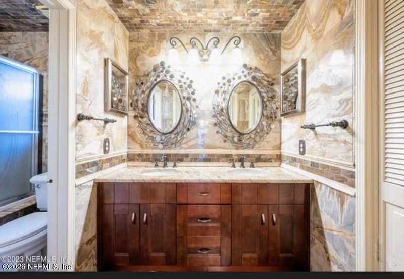 4442 River Trail Road Jacksonville, FL 32277 - Photo 5 of 38 a bathroom with a sink and a mirror