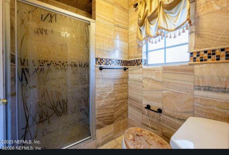 4442 River Trail Road Jacksonville, FL 32277 - Photo 7 of 38 a bathroom with a shower
