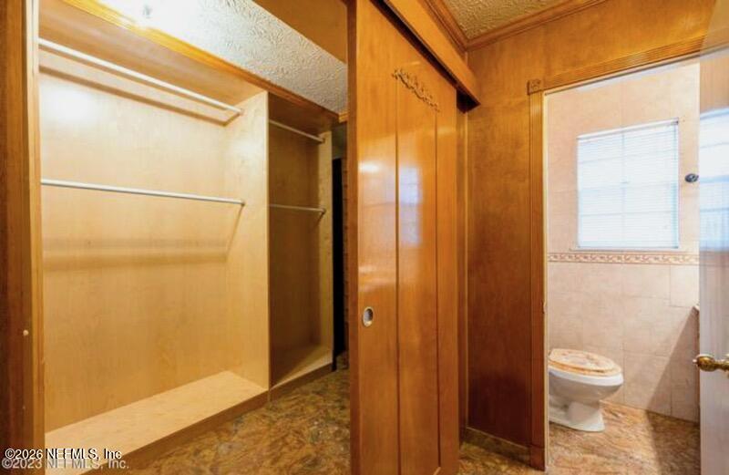 4442 River Trail Road Jacksonville, FL 32277 - Photo 9 of 38 a bathroom with a shower and a toilet