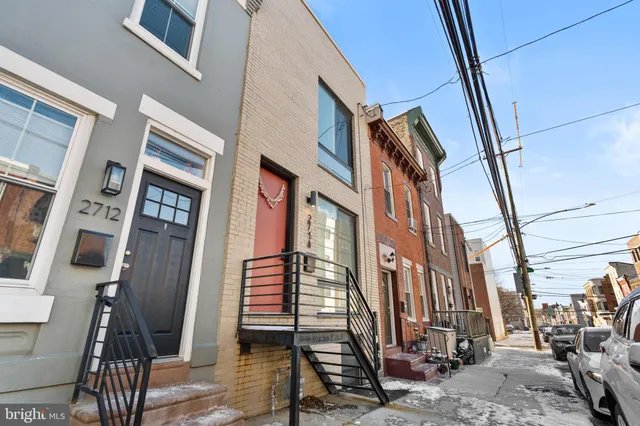 a view of a brick building with many windows