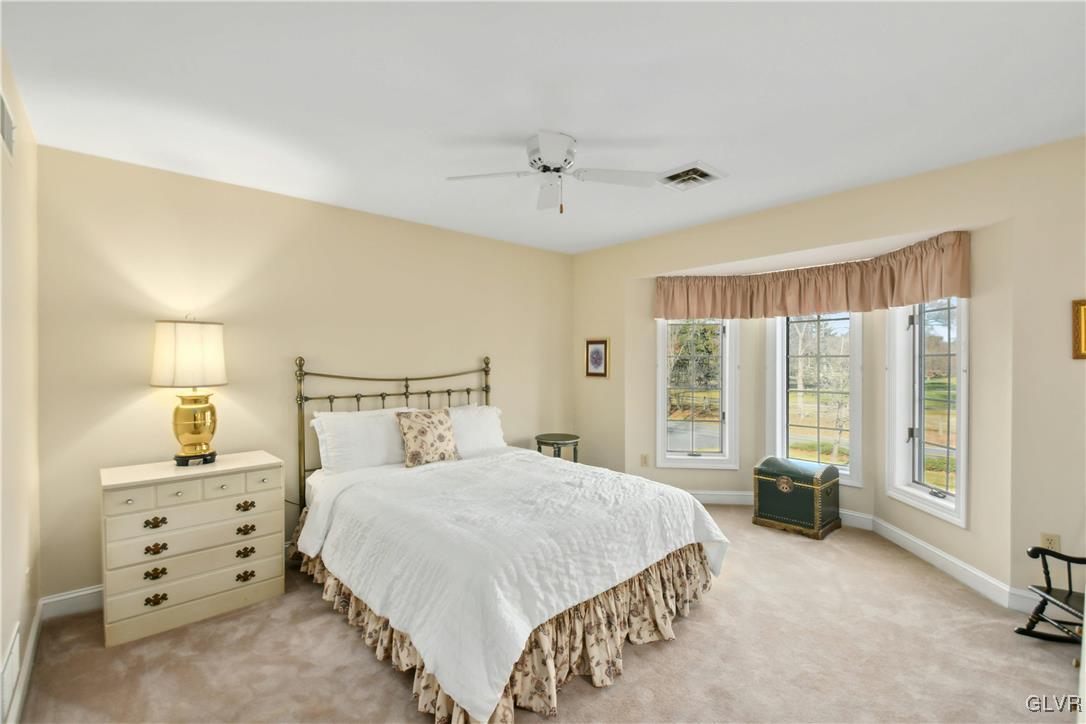 2154 Spring Valley Road Bethlehem, PA 18015 - Photo 31 of 50 a bedroom with a large bed and three windows