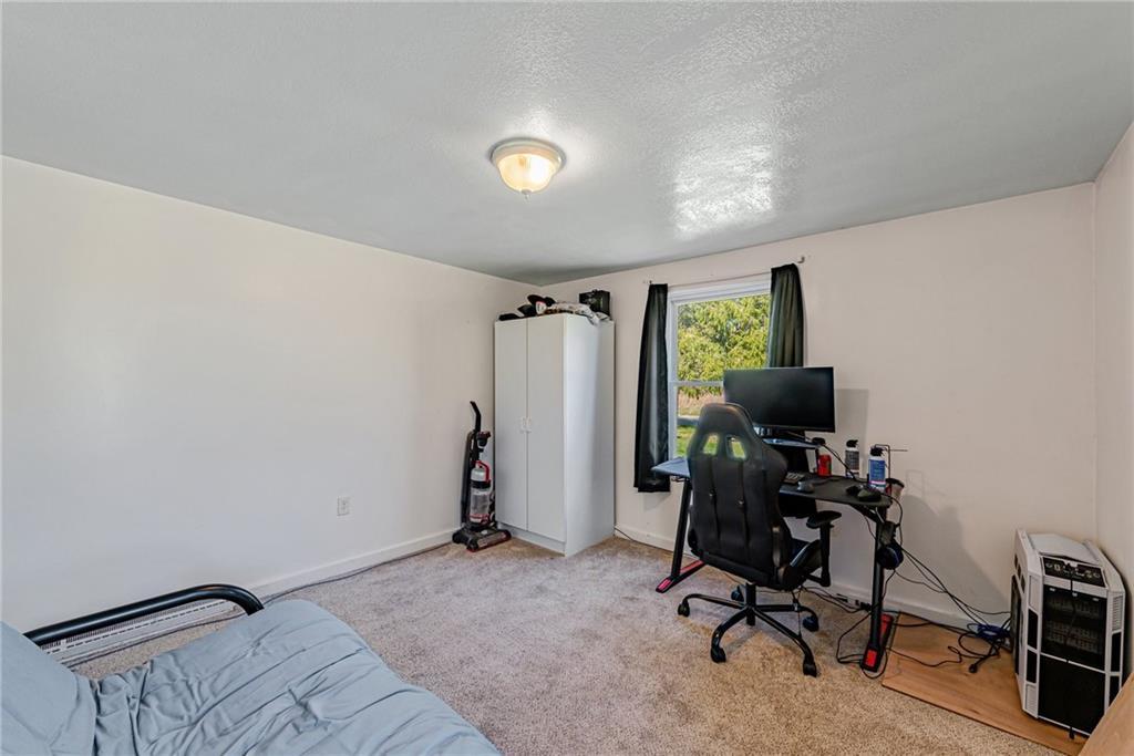 184 Glen Eden Road Rochester, PA 15074 - Photo 13 of 25 a view of a workspace with furniture and a window