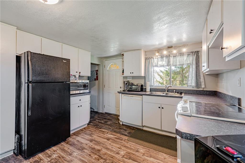 184 Glen Eden Road Rochester, PA 15074 - Photo 8 of 25 a kitchen with a refrigerator and a sink