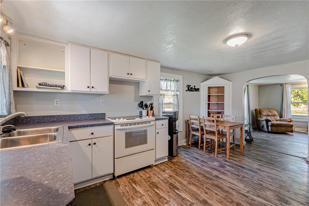 184 Glen Eden Road Rochester, PA 15074 - Photo 9 of 25 a kitchen with appliances a sink and chairs
