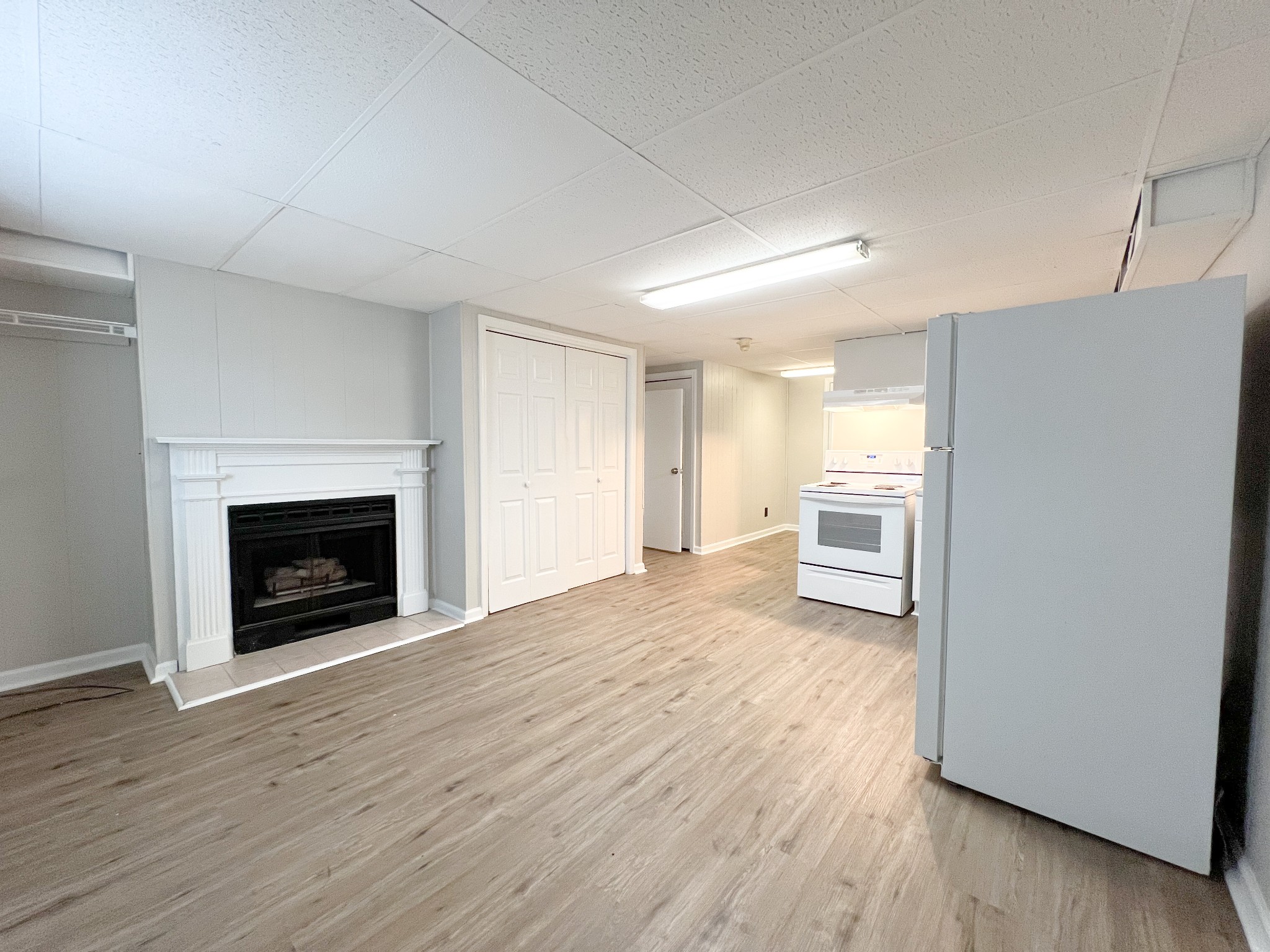 175 Condor Court Clarksville, TN 37042 - Photo 3 of 14 a view of a room with wooden floor and a fireplace