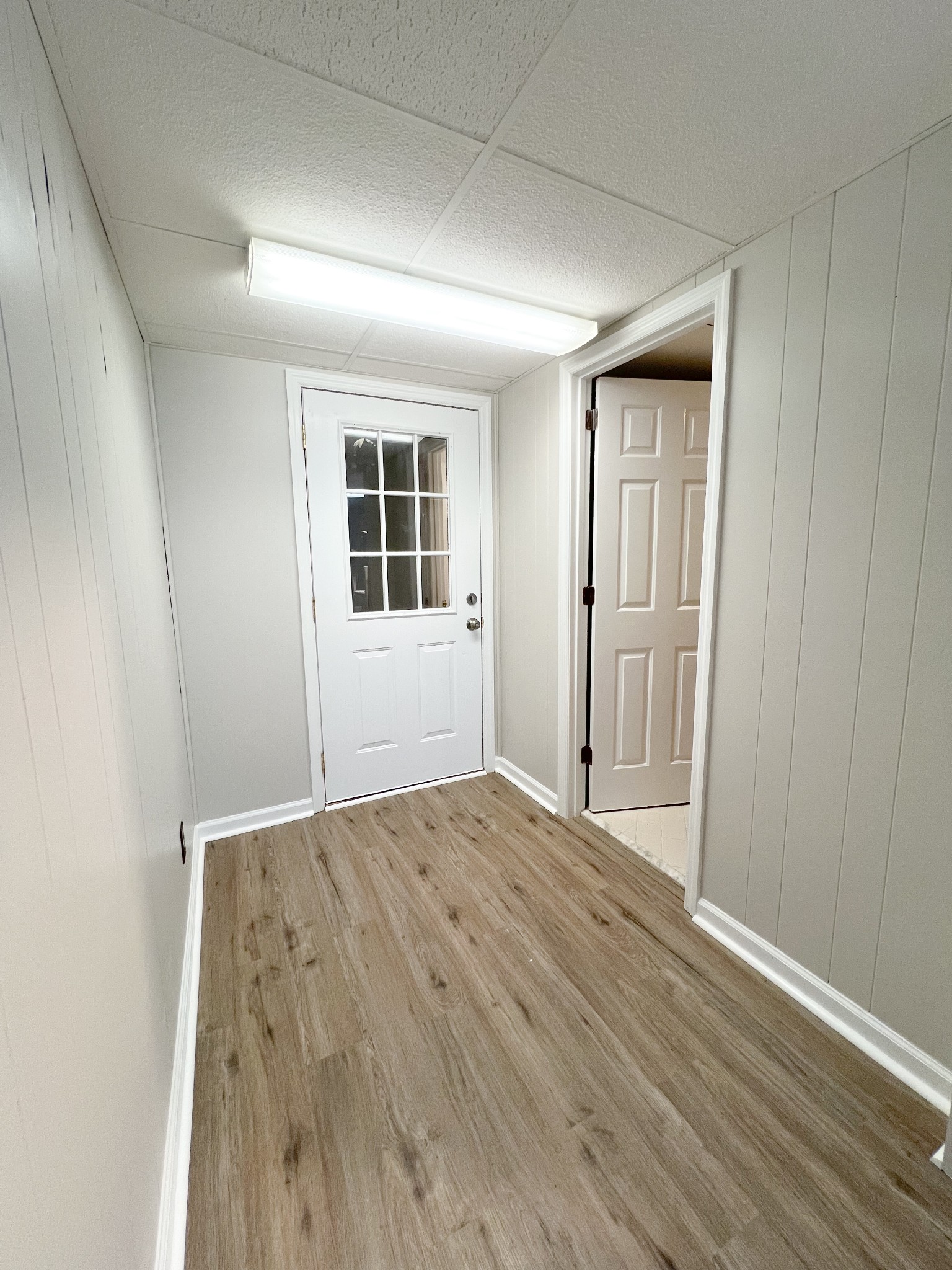 175 Condor Court Clarksville, TN 37042 - Photo 7 of 14 an empty room with wooden floor and windows