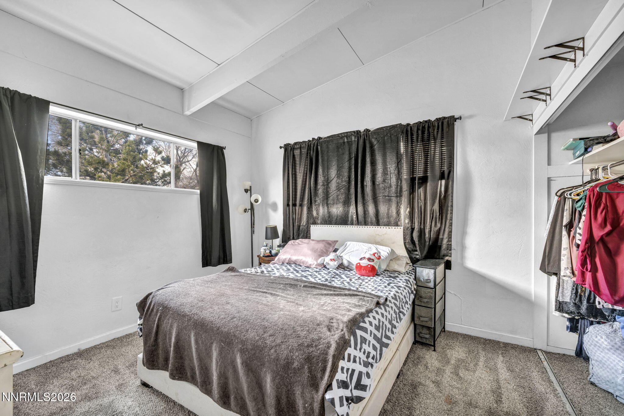 11932 Rocky Mountain Street Reno, NV 89506 - Photo 12 of 26 a bedroom with a bed and a window