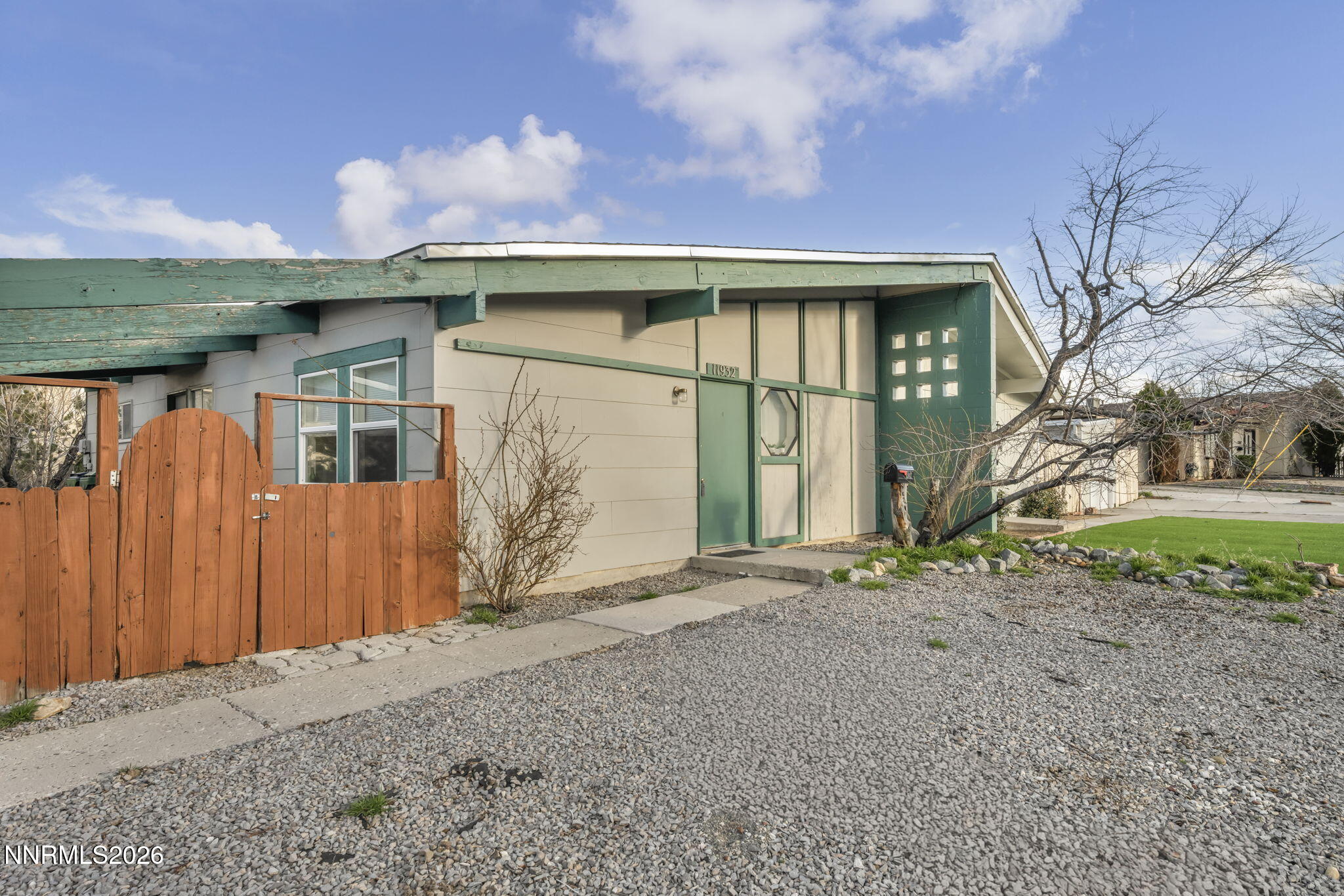 11932 Rocky Mountain Street Reno, NV 89506 - Photo 2 of 26 a view of a house with a garden