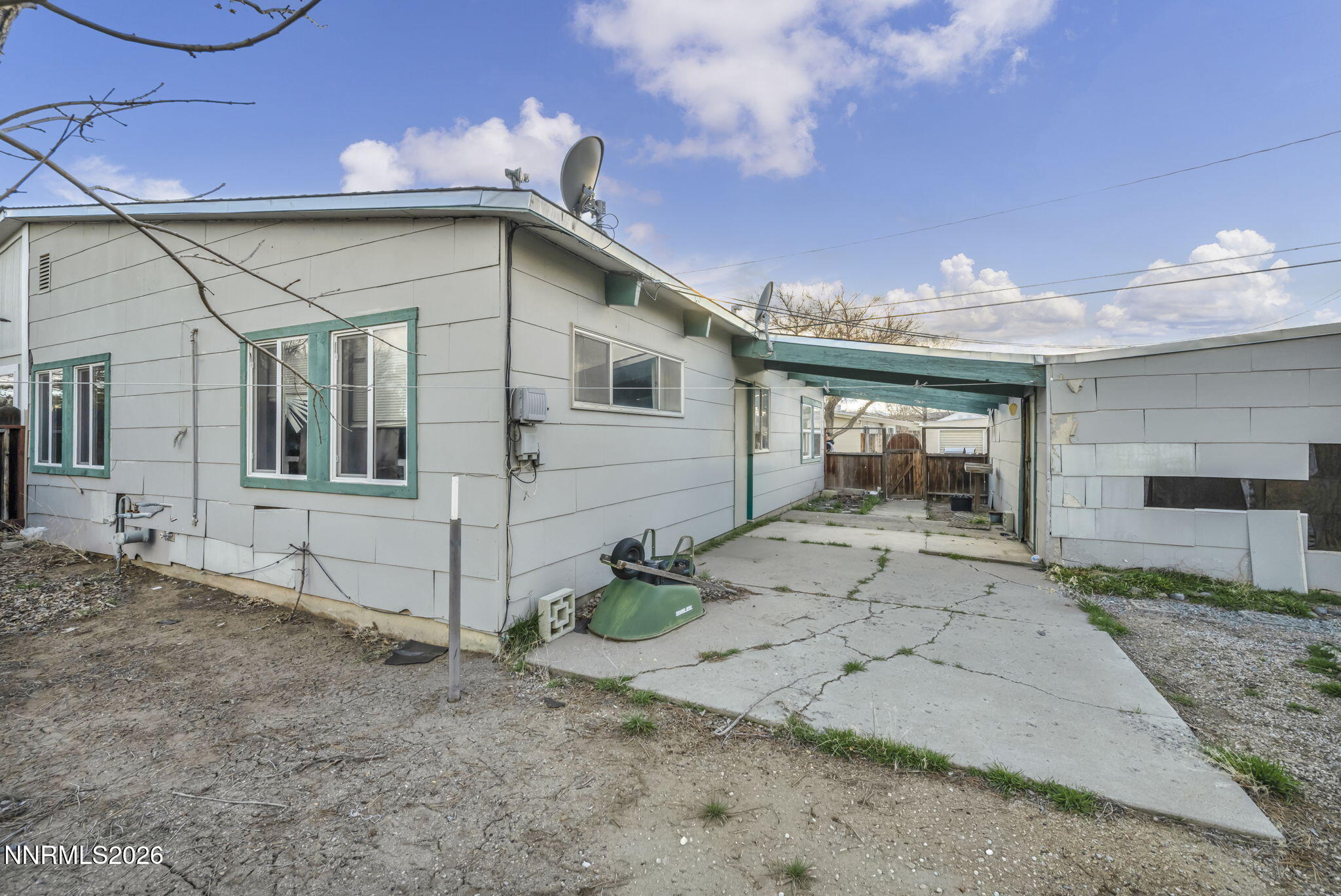 11932 Rocky Mountain Street Reno, NV 89506 - Photo 23 of 26 a front view of a house with a yard