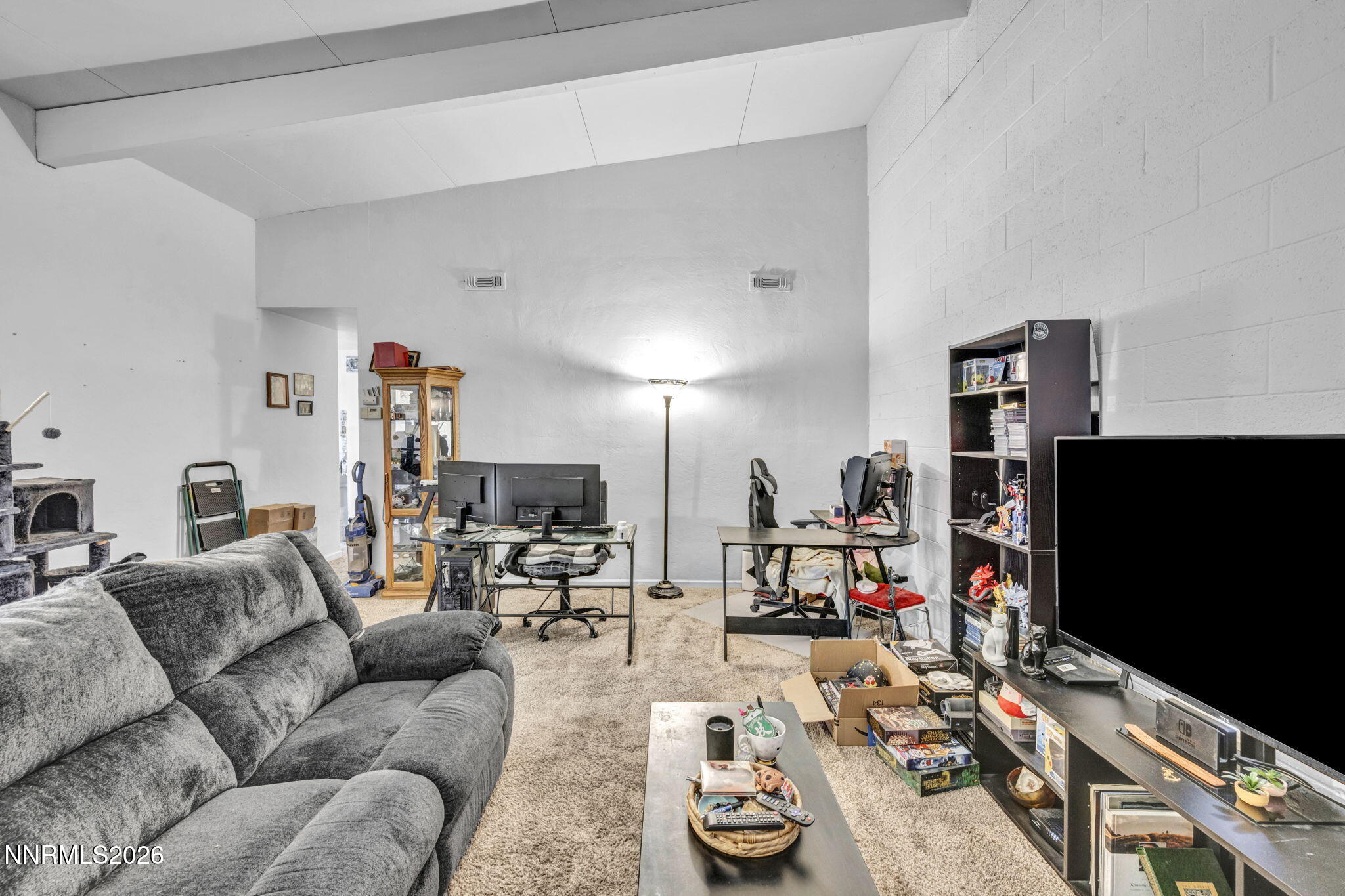 11932 Rocky Mountain Street Reno, NV 89506 - Photo 3 of 26 a living room with furniture and a flat screen tv