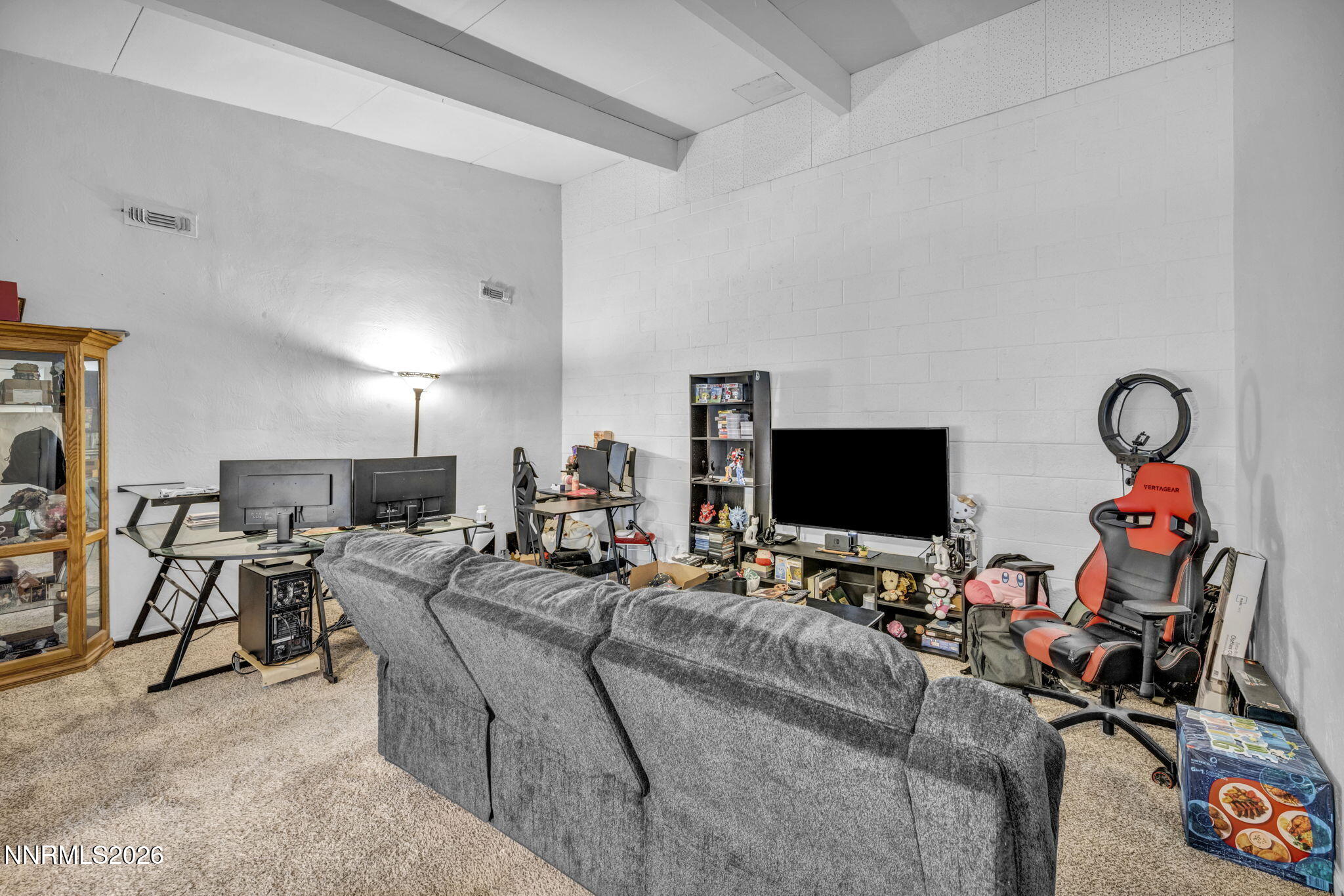 11932 Rocky Mountain Street Reno, NV 89506 - Photo 4 of 26 a living room with furniture and a flat screen tv