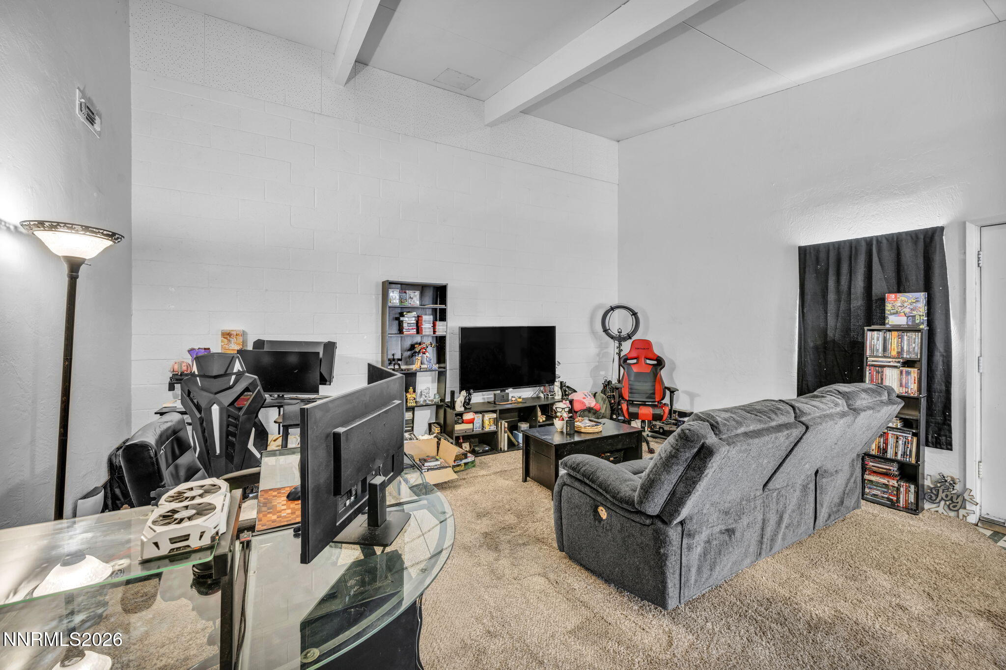 11932 Rocky Mountain Street Reno, NV 89506 - Photo 5 of 26 a living room with furniture and a flat screen tv