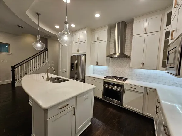 a utility room with wooden floor and windows