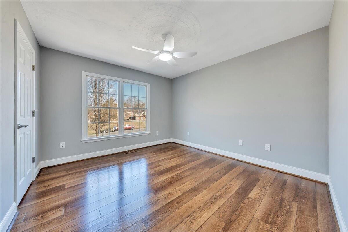 1510 Navigation Point Goodview, VA 24095 - Photo 23 of 48 wooden floor in an empty room with a window