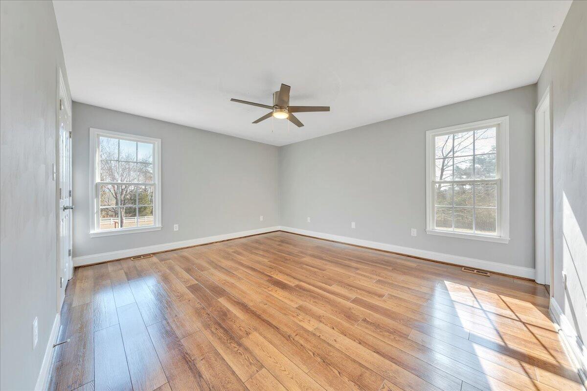 1510 Navigation Point Goodview, VA 24095 - Photo 25 of 48 wooden floor in an empty room with a window