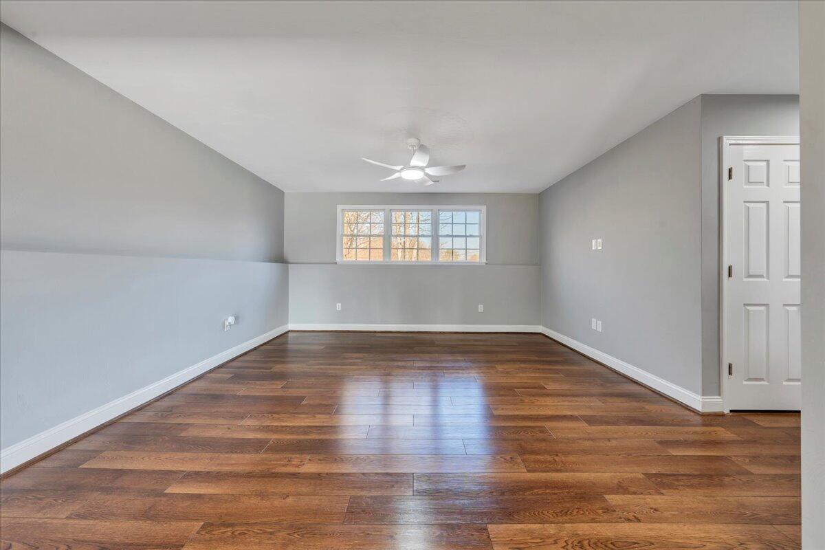 1510 Navigation Point Goodview, VA 24095 - Photo 30 of 48 an empty room with wooden floor and windows